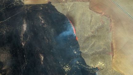 The progression of the fire is visible from space, as shown in this satellite image from Maxar Technologies focusing on the northwest of the village of Miami, about fifty kilometers from Amarillo, on February 28, 2024. (SATELLITE IMAGE 2024 MAXAR TECH / AFP)