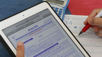 &nbsp; (La réforme du barème et celle de la décote vont permettre cette année à 9,3 millions de foyers fiscaux de payer moins d'impôts © Maxppp)