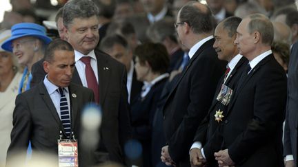 &nbsp; (Le président ukrainien, Petro Porochenko, et le chef du Kremlin, Vladimir Poutine, s'étaient rencontrés pour la première fois début juin, en Normandie.  © MaxPPP / Alexandre Marchi)