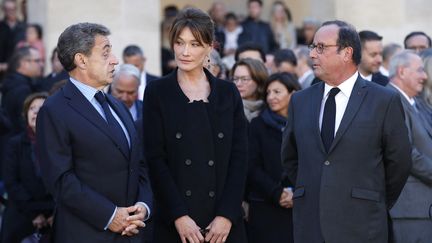 Nicolas Sarkozy, Carla Bruni et François Hollande, le 5 octobre 2018 à Paris lors de l'hommage national à Charles Aznavour aux Invalides. (CHRISTOPHE ENA / AFP)