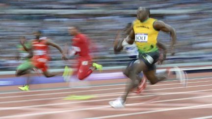 Usain Bolt a survolé sa demi-finale (ADRIAN DENNIS / AFP)