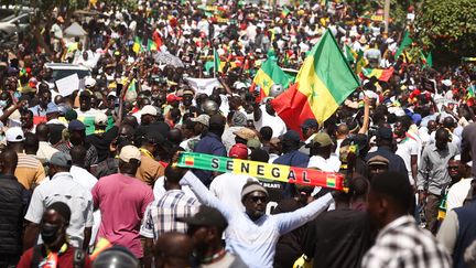 Demonstrators in the streets of Dakar (Senegal), on February 17, 2024, demand the maintenance of the presidential election.  (CEM OZDEL / ANADOLU VIA AFP)