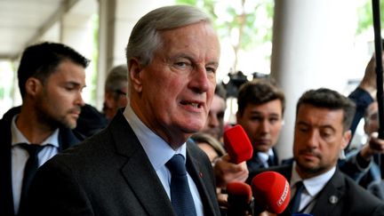 Le Premier ministre Michel Barnier lors d'un déplacement à Reims (Marne), le 11 septembre 2024. (FRANCOIS NASCIMBENI / AFP)