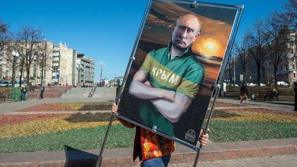 Moscou, le 16 mars 2015: représentation de Vladimir Poutine dans le cadre d'une exposition de dessins en plein air. (AFP PHOTO / DMITRY Serebryakov)