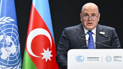 Le Premier ministre russe Mikhaïl Michoustine, à la tribune de la COP29, à Bakou, en Azerbaïdjan, le 13 novembre 2024. (ALEXANDER NEMENOV / AFP)