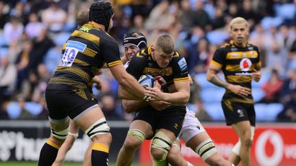 Le joueur des Wasps&nbsp;Jack Willis&nbsp;ceinturé contre Northampton, lors du dernier match de cette équipe, le 9 octobre 2022, avant son placement en redressement judiciaire. (PHIL MINGO / PPAUK / SHUTTERSTOCK / SIPA)