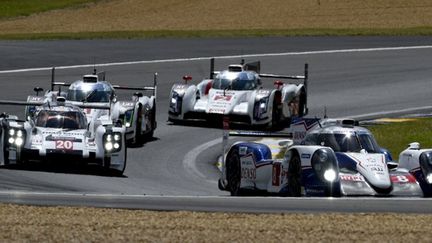 Toyota, Audi et Porsche se suivent de près (GUILLAUME SOUVANT / AFP)