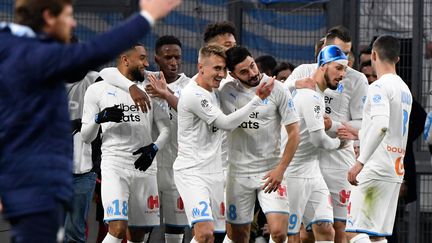 La joie de l'Olympique de Marseille à l'image contraste avec la grise mine qui s'annonce  (GERARD JULIEN / AFP)