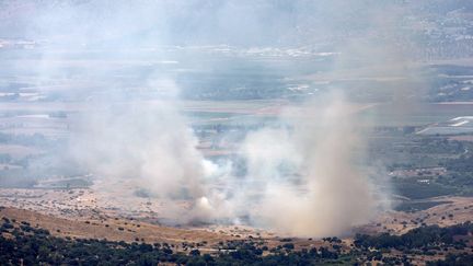 Smoke billows into the sky after a rocket fired from southern Lebanon into the Upper Galilee region of Israel on July 21, 2024. (JALAA MAREY / AFP)