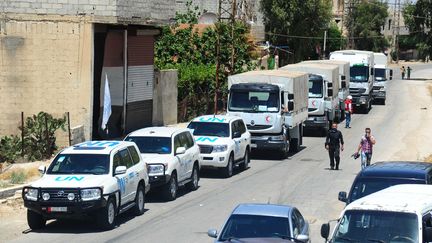 Un convoi humanitaire entre à Daraya (Syrie), le 1er juin 2016. (AMMAR / NURPHOTO / AFP)