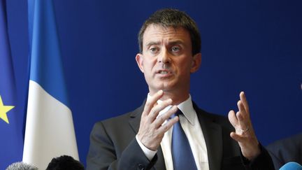 Le ministre de l'Int&eacute;rieur, Manuel Valls, lors d'une conf&eacute;rence de presse &agrave; Trappes (Yvelines), le 22 juillet 2013. (FRANÇOIS GUILLOT / AFP)