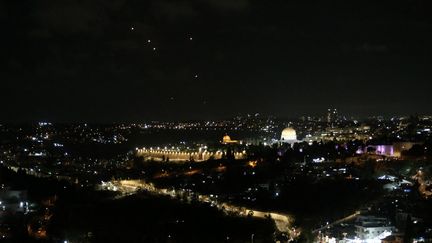 Rockets fired from Iran towards Israel are visible over Jerusalem on October 1, 2024. (SAEED QAQ / ANADOLU)