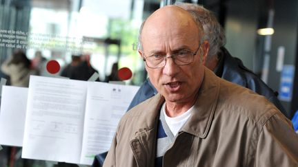 Gilles Patron,&nbsp;"p&egrave;re d'accueil" de La&euml;titia Perrais, au palais de justice de Nantes (Loire-Atlantique), le 18 mars 2014. (FRANK PERRY / AFP)