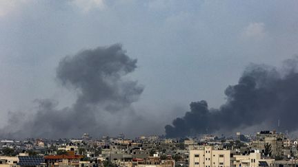 Smoke rises above Khan Younes, the large city in southern Gaza, on January 14, 2024. (AFP)