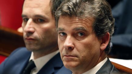 Le ministre de l'Education beno&icirc;t Hamon et le ministre de l'Economie Arnaud Montebourg, lors des questions au gouvernement, &agrave; l'Assembl&eacute;e nationale, le 15 juillet 2014. ( CHARLES PLATIAU / REUTERS)