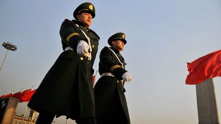 Des policiers chinois &agrave; P&eacute;kin, le capitale chinoise, le 3 mars 2013. (YI AIDI / IMAGINECHINA / AFP)