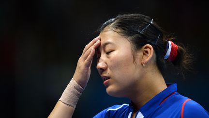 La fran&ccedil;aise Li Xue lors du permier tout qualificatif de tennis de table dimanche 29 juillet aux Jeux olympiques de Londres. (SAEED KHAN / AFP)