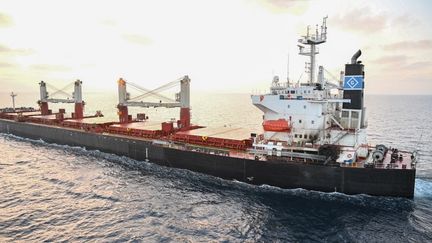 This photograph released on January 18, 2024 by India's Ministry of Defense shows a Marshall Islands-flagged ship following a drone attack in the Gulf of Aden.  (INDIAN MINISTRY OF DEFENSE / AFP)