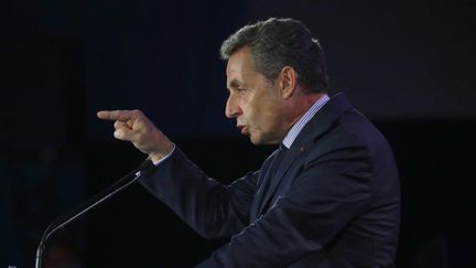 Nicolas Sarkozy, candidat à la primaire de la droite, durcit son discours (AFP/PATRICK KOVARIK)