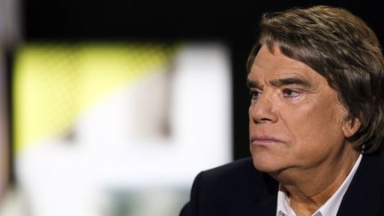 Bernard Tapie, sur le plateau d'i-T&eacute;l&eacute;, le 10 juillet 2013.&nbsp; (FRED DUFOUR / AFP)