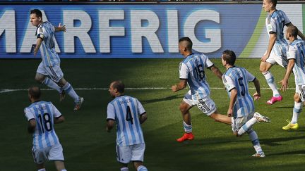 L'Argentin Lionel Messi c&eacute;l&egrave;bre son but inscrit &agrave; la toute fin du match contre l'Iran, le 21 juin &agrave; Belo Horizonte. Malgr&eacute; les critiques, la "Pulga" est &eacute;lue meilleur joueur du tournoi. (LEONHARD FOEGER / REUTERS)