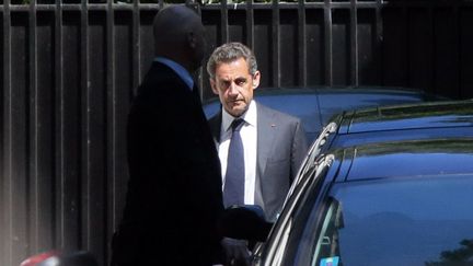 L'ancien pr&eacute;sident de la R&eacute;publique, Nicolas Sarkozy, quitte son domicile, &agrave; Paris, mercredi 2 juillet 2014. (JACQUES DEMARTHON / AFP)