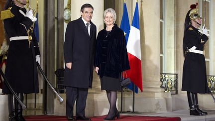 François Fillon et Penelope Fillon, le 26 janvier 2012, à l'Elysée. (LIONEL BONAVENTURE / AFP)