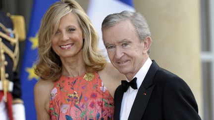 L'homme d'affaires Bernard Arnault et sa femme, le 6 juin 2014 &agrave; l'Elys&eacute;e. (FRED DUFOUR / AFP)