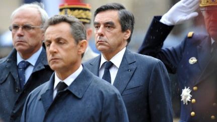 Le président, Nicolas Sarkozy, et le premier ministre, François Fillon, aux Invalides le 19 juillet 2011 (AFP - ERIC FEFERBERG)