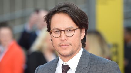 Le réalisateur Cary Joji Fukunaga, le 13 septembre 2018 à Londres (Royaume-Uni). (ANTHONY HARVEY / AFP)