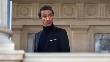 L'ex-avocat Karim Achoui, le 17 septembre 2013, au palais de justice de Paris. (MARTIN BUREAU / AFP)