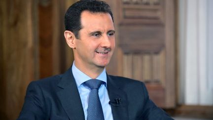 Bachar Al-Assad, le 26 ao&ucirc;t 2015 &agrave; Damas (Syrie). (SANA / AFP)