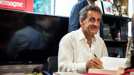 Nicolas Sarkozy lors de la dédicace de son livre ''Passions'', publié en juin 2019 aux éditions de L'Observatoire.&nbsp; (FRANCK BESSIERE / HANS LUCAS)