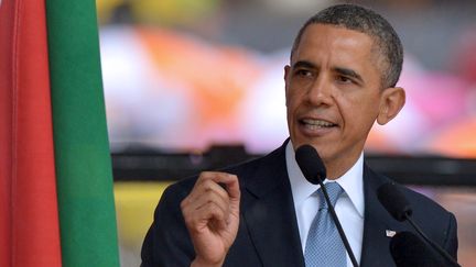 Barack Obama s'exprime lors de la c&eacute;r&eacute;monie d'hommage &agrave; Nelson Mandela, le 10 d&eacute;cembre 2013, &agrave; Soweto (Afrique du Sud). (ALEXANDER JOE / AFP)