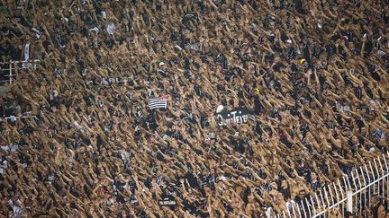 Des supporters br&eacute;siliens du&nbsp;Sport Club Corinthians Paulista lors du match face CD Cruz Azul mexicain en match de la Copa Libertadores &agrave; Sao Paolo (Br&eacute;sil), le 21 mars 2012. (YASUYOSHI CHIBA / AFP)