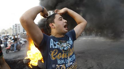 Un habitant de Beyrouth (Liban) proteste contre l'enl&egrave;vement de p&egrave;lerins chiites en Syrie, le 22 mai 2012. (ANWAR AMRO / AFP)