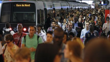 Des usagers sortent d'un train en gare du Nord, &agrave; Paris, le 13 juin 2014. (GONZALO FUENTES / REUTERS)