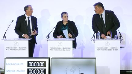 Les trois candidats à l'élection du président du CNOSF, en mai 2017&nbsp;: Denis Masseglia (réelu), Isabelle Lamour et David Douillet. (PATRICK KOVARIK / AFP)