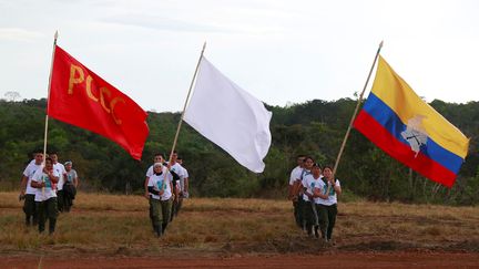 Des membres des Farc défilent lors de leur congrès annuel, le 23 septembre 2016, près d'El Diamante&nbsp;(Colombie). (JOHN VIZCAINO / REUTERS)