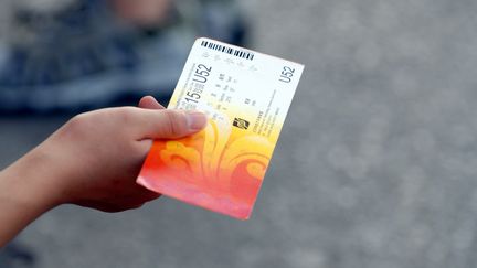 Un billet pour assister aux Jeux olympiques de Pékin 2008, le 15 août 2008. (ZHANG HUIBIN / IMAGINECHINA / AFP)