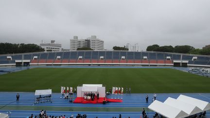 La cérémonie de relais de la flamme olympique lors de son arrivée à Tokyo (Japon), le 9 juillet 2021. (MIHO TAKAHASHI / YOMIURI / AFP)