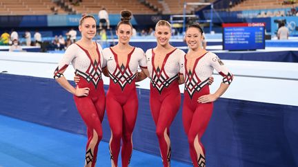 Les gymnastes allemandes&nbsp;Elisabeth Seitz, Sarah Voss, Pauline Schaefer-Betz et Kim Bui, le 25 juillet 2021 à Tokyo. (MARIJAN MURAT / DPA / AFP)