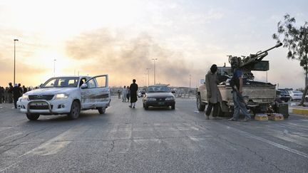  (Les djihadistes de l'EIIL à l'entrée de Mossoul © REUTERS)