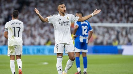 Kylian Mbappé, buteur avec le Real Madrid face au Deportivo Alavés lors de la 7e journée de Liga, le 24 septembre 2024. (ALBERTO GARDIN / AFP)