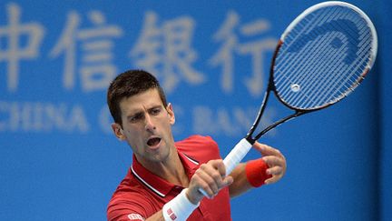 Novak Djokovic  (GOH CHAI HIN / AFP)