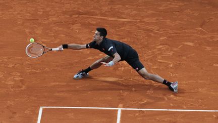 Djokovic en plein effort (JEAN CHRISTOPHE MAGNENET / AFP)