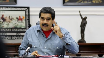 Le président vénézuélien Nicolas Maduro s'exprime depuis le palais présidentiel à Caracas, le 13 mai 2016. (MARCELO GARCIA / PRESIDENCIA VENEZUELA / AFP)