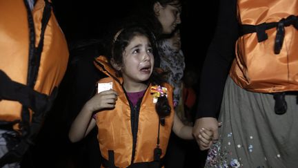 &nbsp; (Une petite fille syrienne débarque sur l'île grecque de Kos dans la nuit du 20 au 21 aout 2015 © Maxppp)