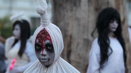 Ces jeunes de Jakarta (Indonésie) semblent sortir tout droit d'un film d'épouvante, samedi 31 octobre 2015.&nbsp; (AGOES RUDIANTO / ANADOLU AGENCY / AFP)