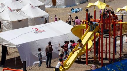 Le 19 juin 2011, une aire de jeux a spécialement été installée dans le camp pour adoucir le séjour des plus petits. ( REUTERS / Umit Bektas )